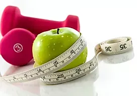an apple with a measuring tape around it